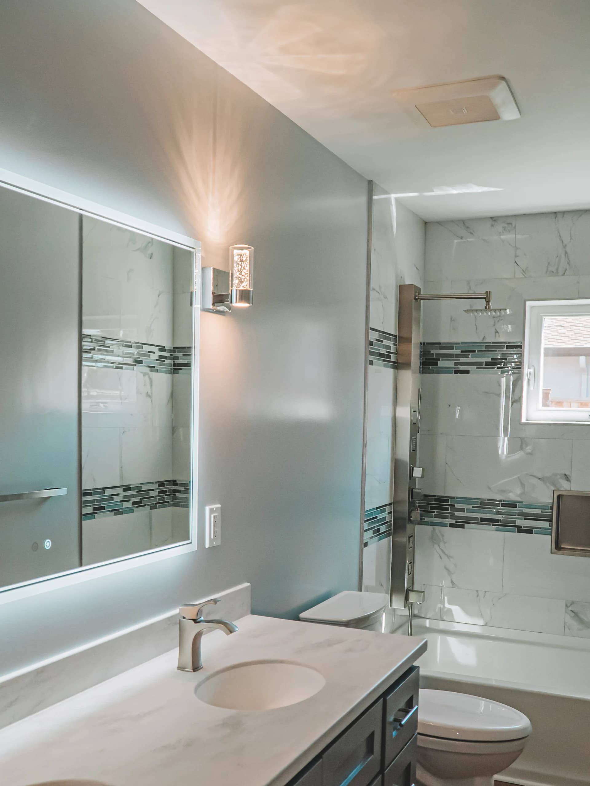 Renovated bathroom with custom tile shower
